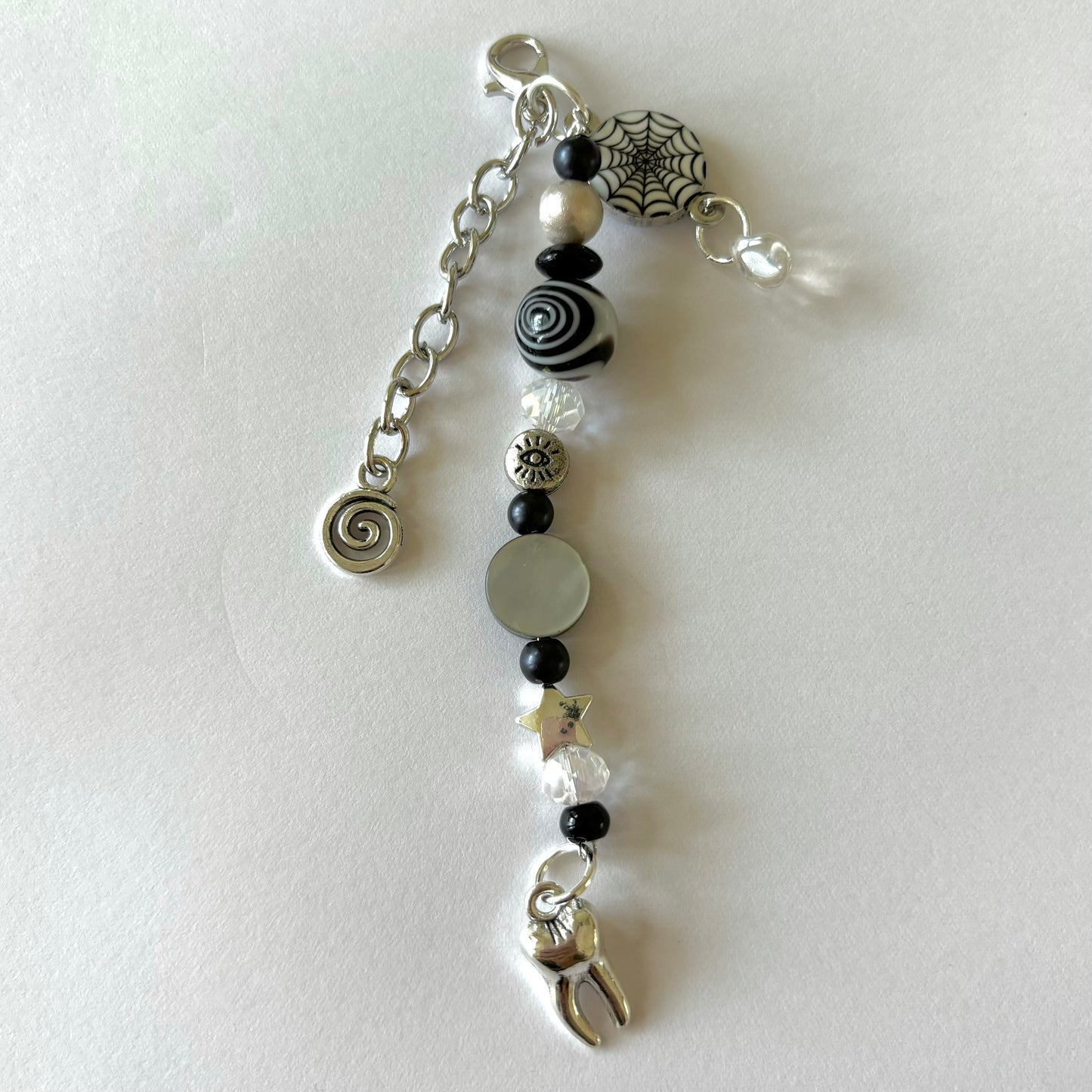 coraline black swirl keychain