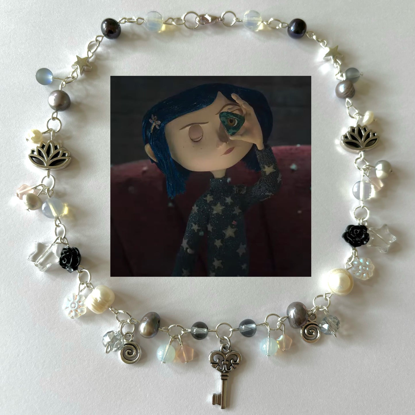 coraline’s trinkets necklace