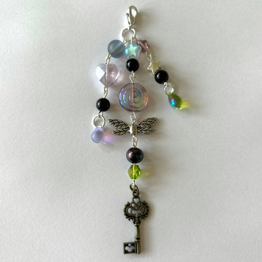 coraline secret garden keychain