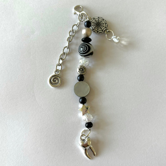 coraline black swirl keychain