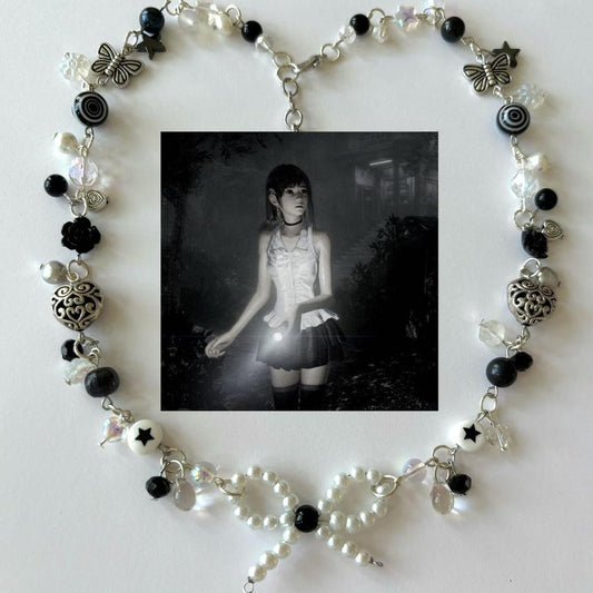horror protagonist “lost” complex necklace