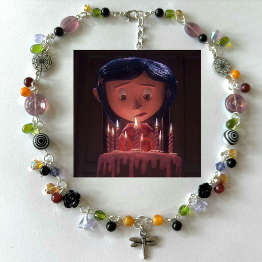 coraline birthday cake necklace